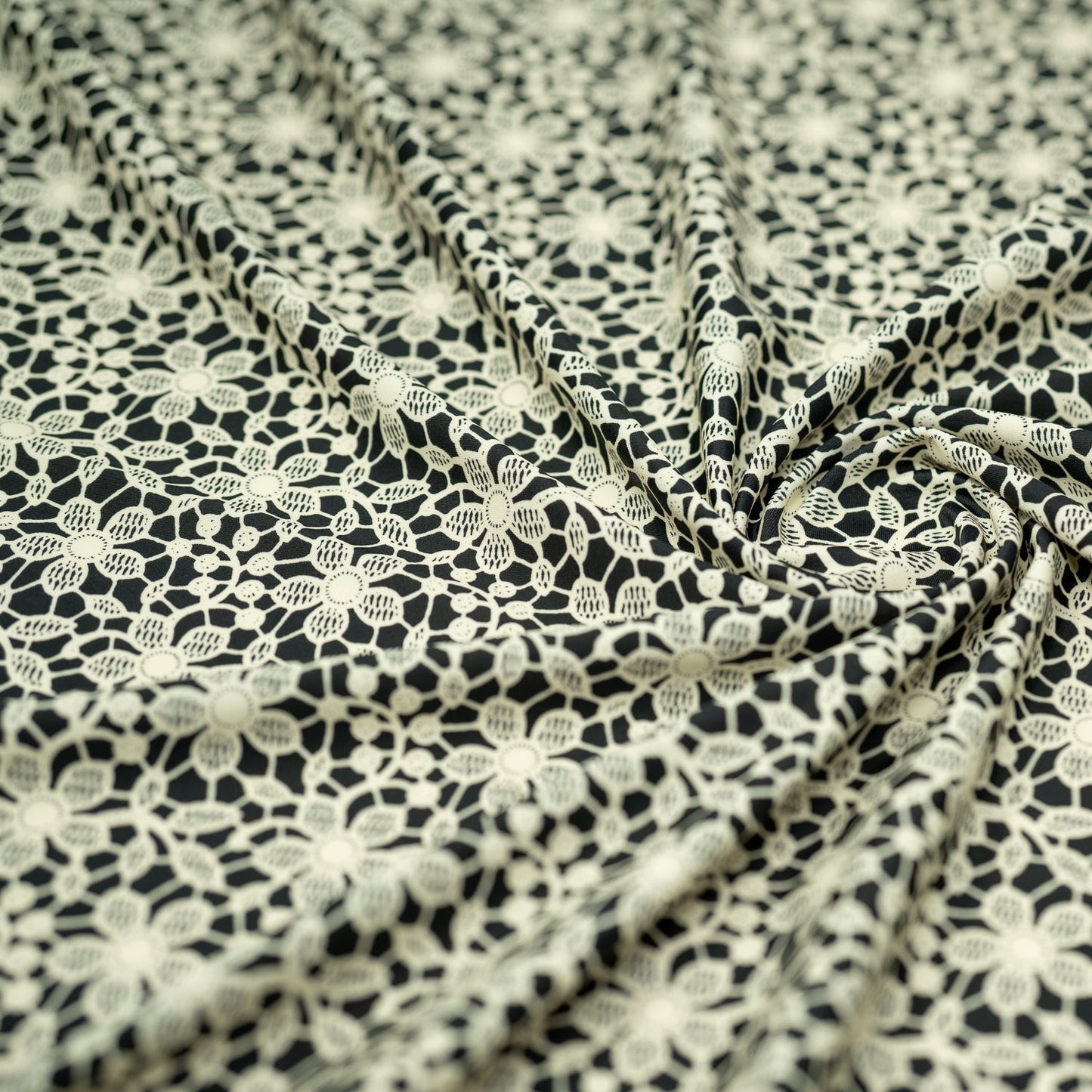 Ivory Flower Lace Pattern on Black Printed Spandex Fabric | Blue Moon Fabrics